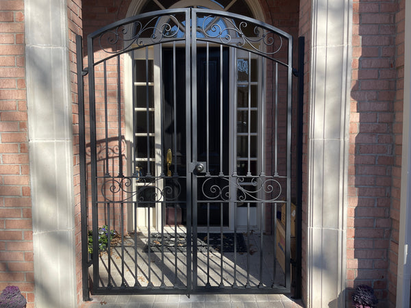 Custom iron gate installation for the front door in Plano!