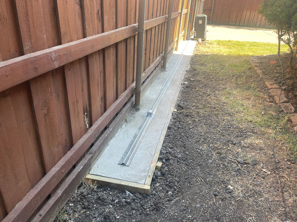 Plano track concrete base installation and fence post repairs